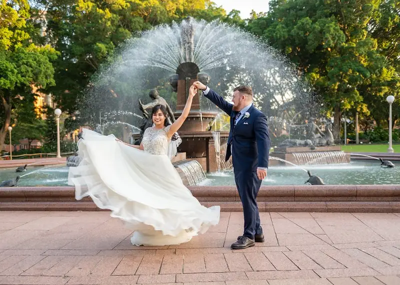 A peaceful garden wedding ceremony scene within Hyde Park, Sydney CBD