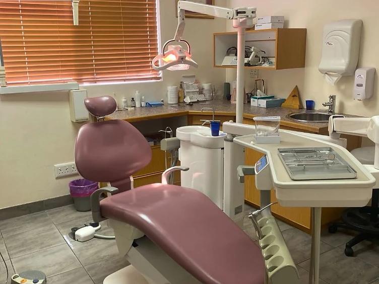 Dr. Bona dental treatment room with chair and equipment