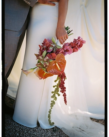 Bouquet detail with a gold wedding band