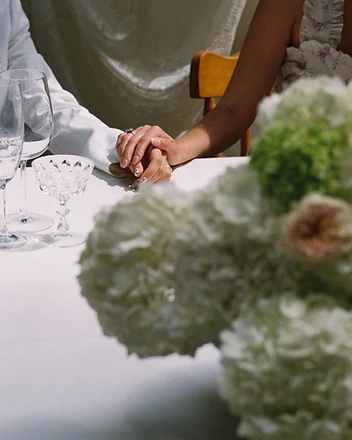 Dramatic full hydrangea installation with draped fabric backdrop