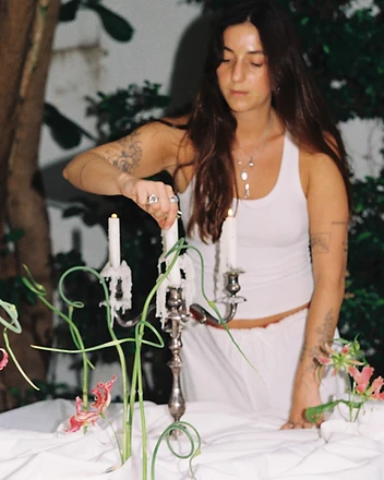 Candelabra and gloriosa lily table installation evening glow