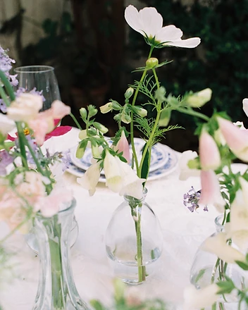 Florist in sunglasses with white hydrangeas outdoors
