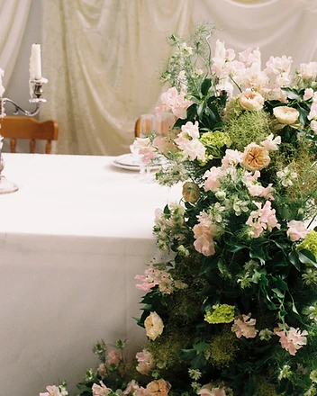 Sweetheart table with pink and ivory floral cascades