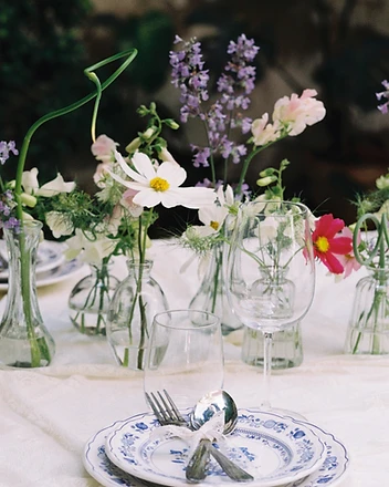 Long garden table from the side with floral centerpiece