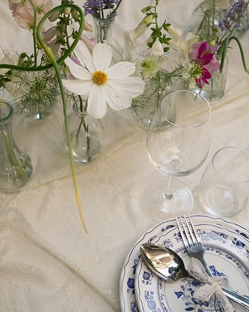 Place setting detail with wildflowers and blue china