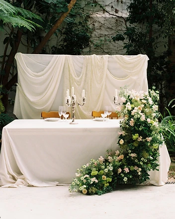 Close detail of pink roses and hydrangeas on table