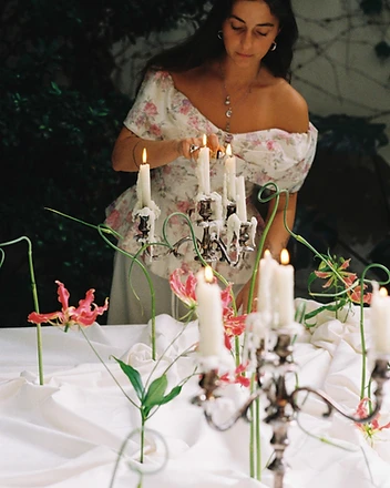 Outdoor garden table with wildflower bud vases and blue china