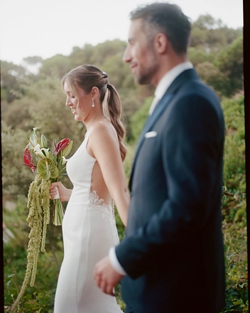 Bride and groom walking together with the bridal bouquet