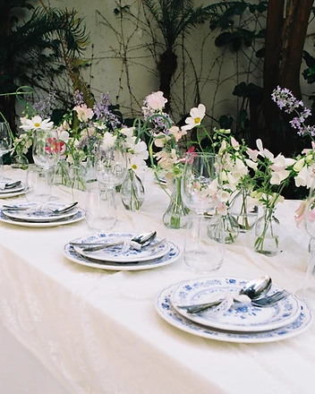 Close view of hands shaping white hydrangea installation