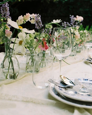 Close detail of cosmos, scabiosa and foxglove bud vases