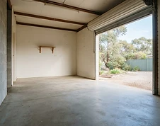 The same garage empty and clean after removal