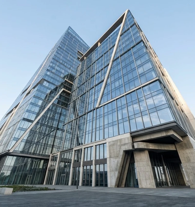 Warsaw modern glass building reflecting a clear sky