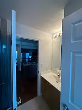 Serviced condo bathroom vanity and mirror after make-ready
