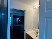 Serviced condo bathroom vanity and mirror after make-ready