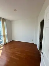 Sunlit condo bedroom after tenant turnover painting