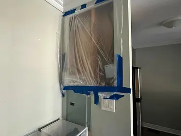 Kitchen wall repair with full dust containment — before