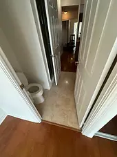 Condo bathroom and hallway tile after make-ready