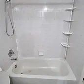 Existing bathtub and wall surround documented before a bathroom renovation