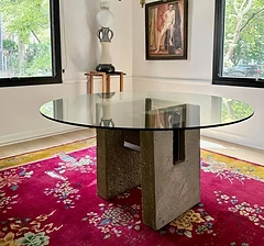 Round glass dining table with stone base
