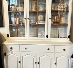 White china hutch with glass doors