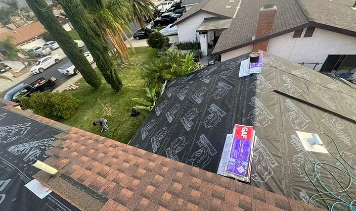 Synthetic underlayment and first shingle courses on hip roof