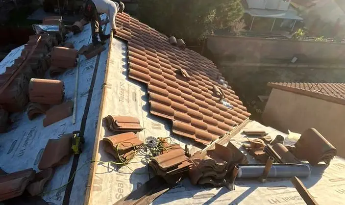 Spanish tile roof reinstallation over new underlayment