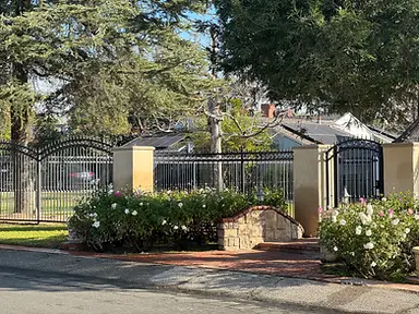 Vertical cedar slat fence over stucco block base — fence and gate installation by Fency Builders in Los Angeles, Los Angeles.
