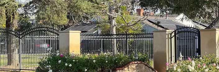 Ornamental Iron Dual-Swing Driveway Gate & Modern Horizontal Fence — Los Angeles in Los Angeles, California