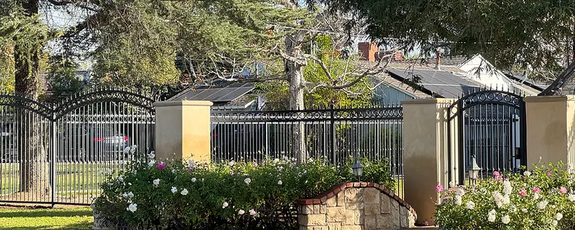 Vertical cedar fence over a stucco wall at a Los Angeles property