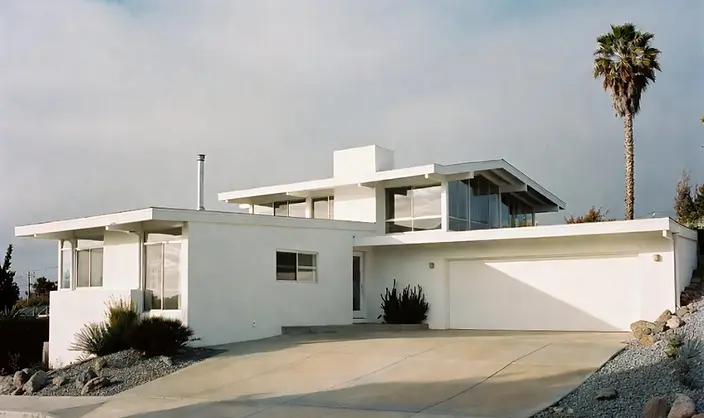 Mid-century modern white stucco home with flat rooflines after a complete exterior painting project