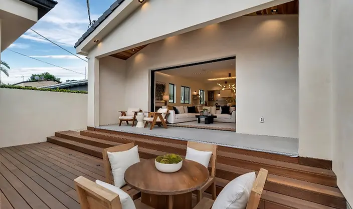 Hardwood deck and covered patio with indoor-outdoor living space