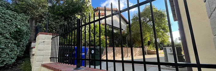 Wrought iron fence set on an existing brick wall in La Crescenta, California