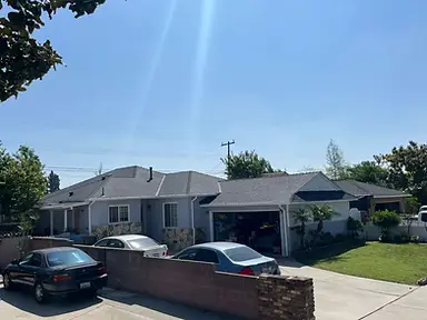 Completed gray architectural-shingle roof across a single-story residential home.