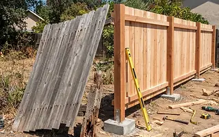 Editorial illustration: Leaning fence section with a rotted post beside a rebuilt section with new posts set in concrete footings