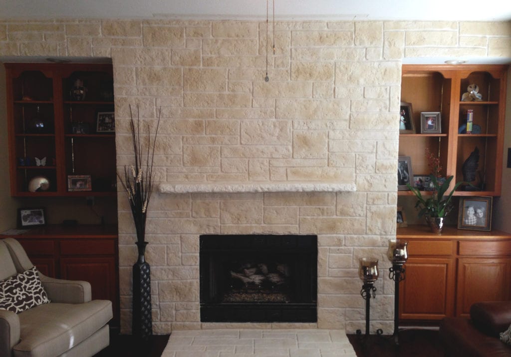 Hand-crafted Cre8stone limestone and quartz overlay fireplace