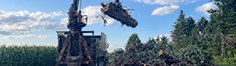 Brown's Tree Service crane on a job site