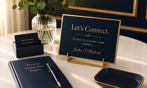 Navy and gold desk sign reading Let's Connect beside branded notebooks and business cards