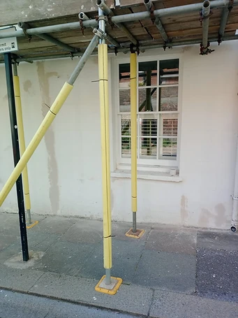 Hairline render cracks at window cill junction — potential water ingress route