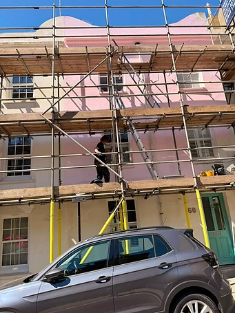 Scaffold elevation before works commenced — defective render visible