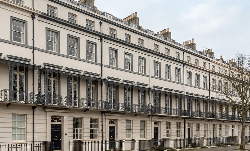 Regency terrace in Brighton with original timber sash windows and painted stucco facade