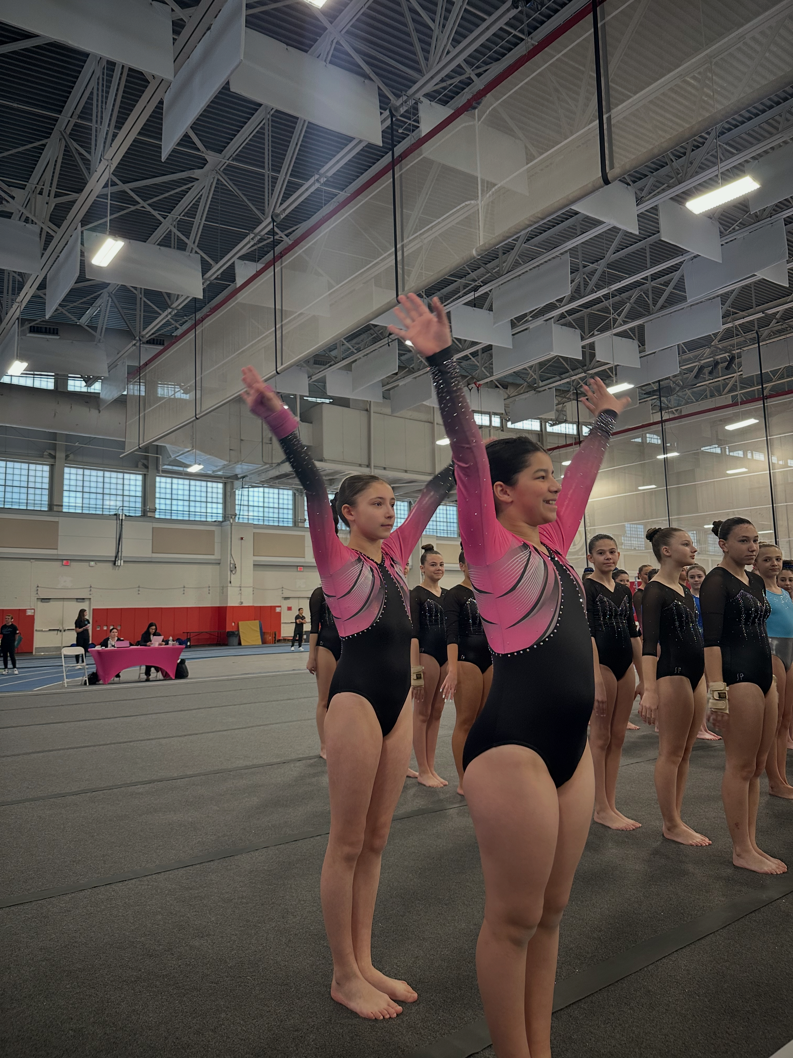 Gymnast with trophy holding award at handstand contest