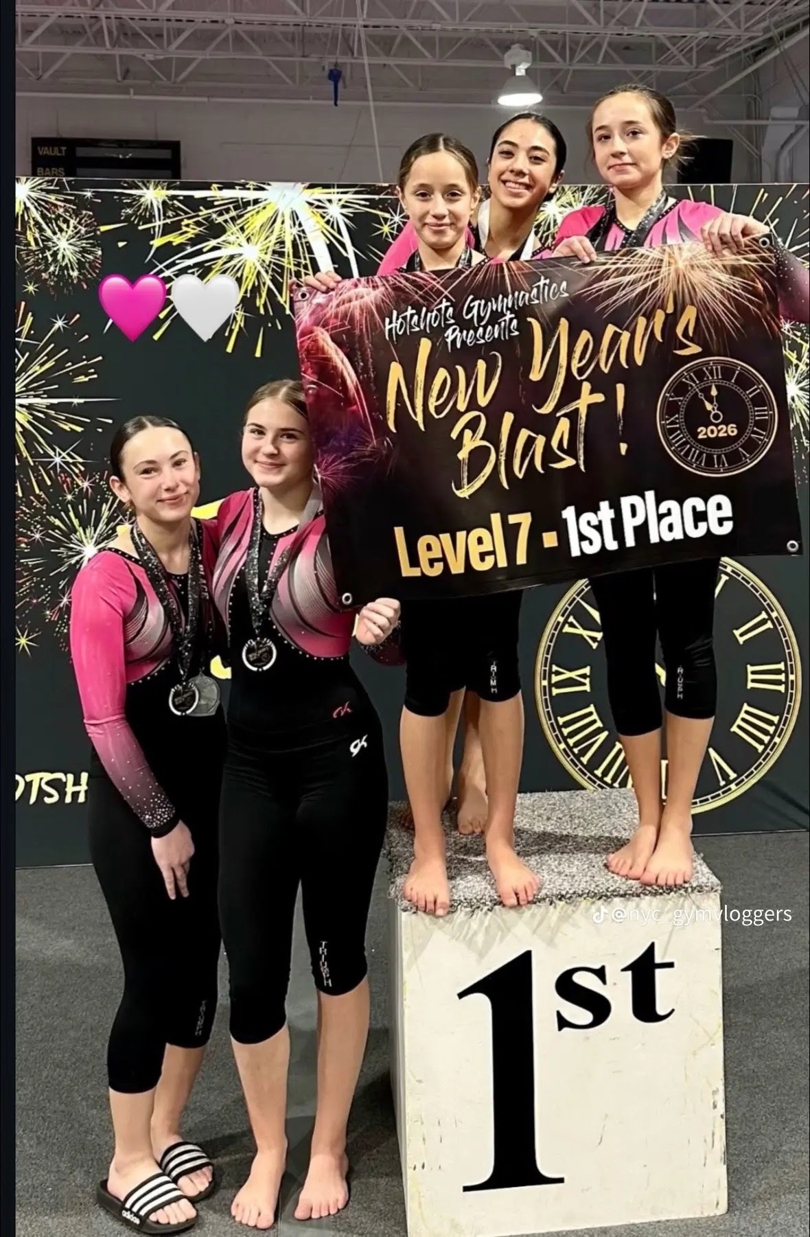 Triumph competitive team gymnasts celebrating a 1st place win