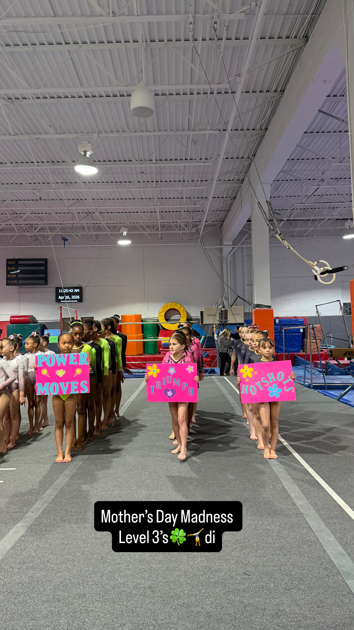 Gymnast with gold medal and hand on chest at competition