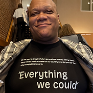 Roderick Smith wearing a t-shirt reading 'Everything we could' at a RootsCamp event.