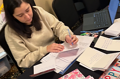 An attendee takes notes at RootsCamp