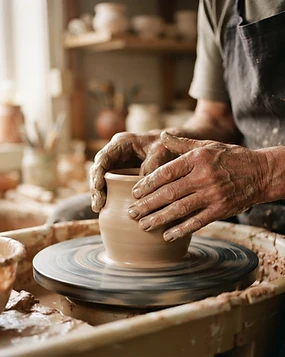 Hands shaping clay