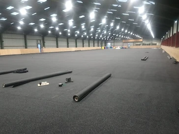 Rolling out the arena floor, weeks before opening day