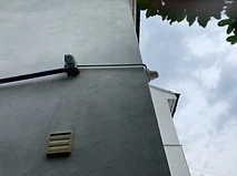 External corner-mounted dome camera with conduit routing