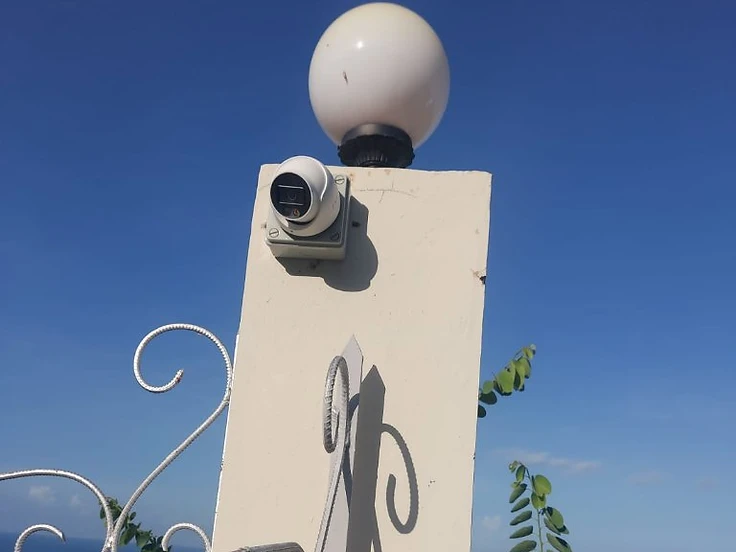 Camera on gate post — clean installation, strong close-up