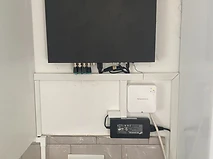 Central recorder and control hardware wall-mounted with Honeywell controller and thermostat